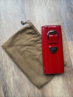 Gucci Red Patent Leather Wallet-Style Phone Case with Buckle Accent